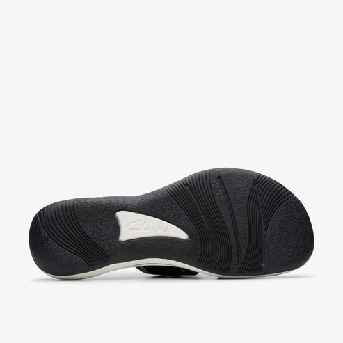 Black and white sandal sole with ridged pattern.