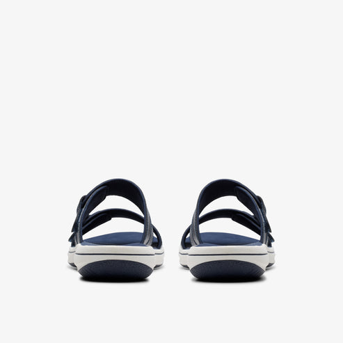 Two navy sandals with adjustable straps, seen from the back.