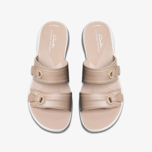 Pair of beige adjustable sandals with two straps.