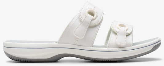 White sandal with two adjustable straps.