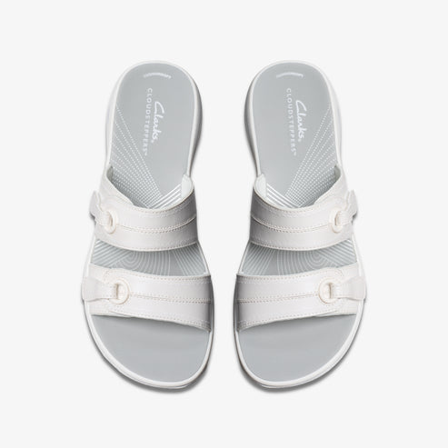 Overhead shot of a pair of Cloudsteppers white slide sandals with two buckled straps and a gray footbed.
