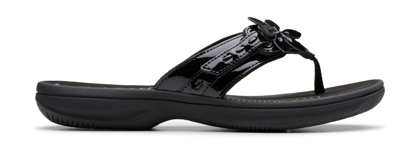Black flip-flop sandal with a flower detail.