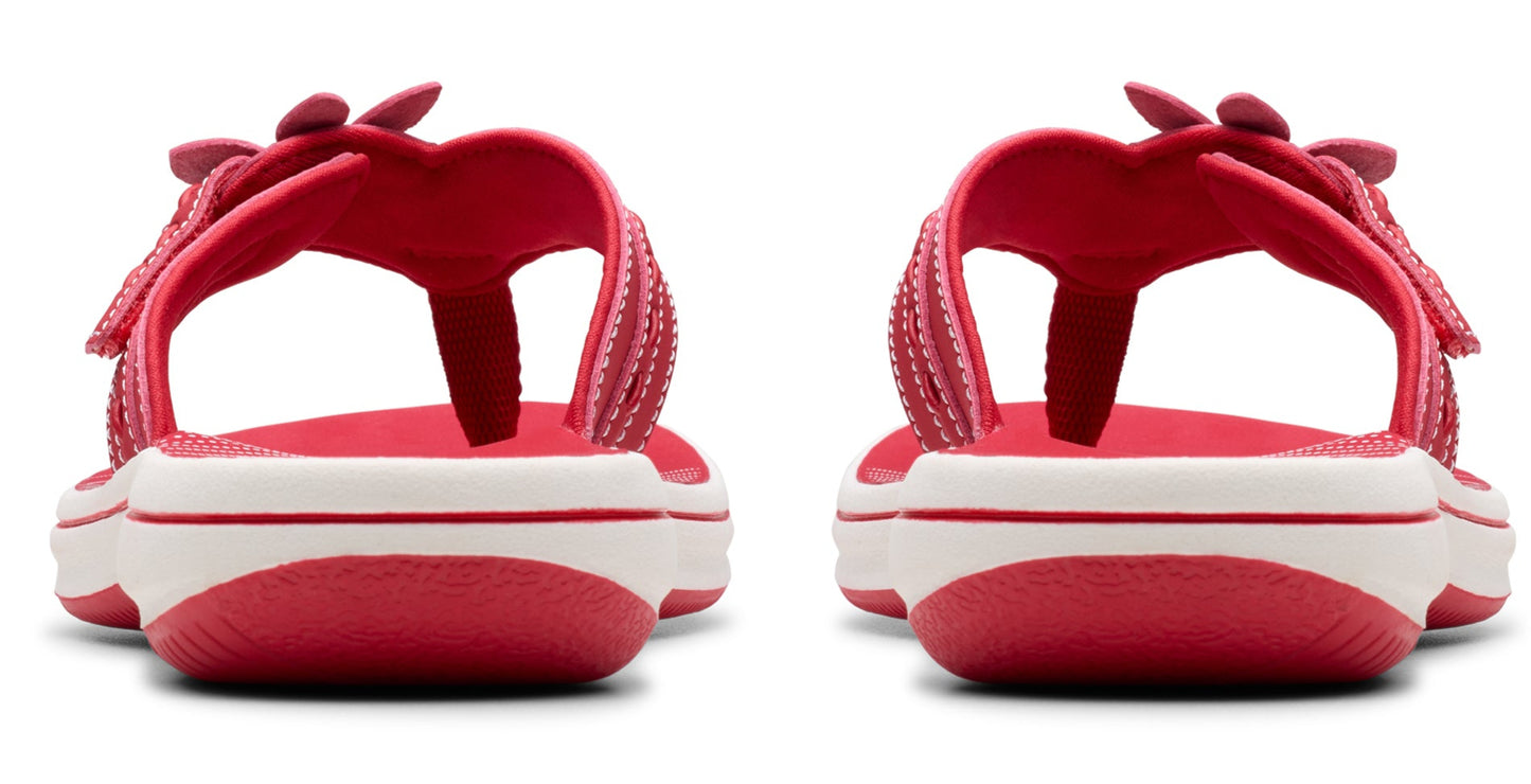 Back view of pink child-sized sandals with flower design.