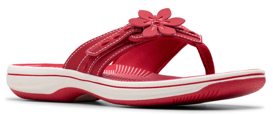 A red sandal with a flower.
