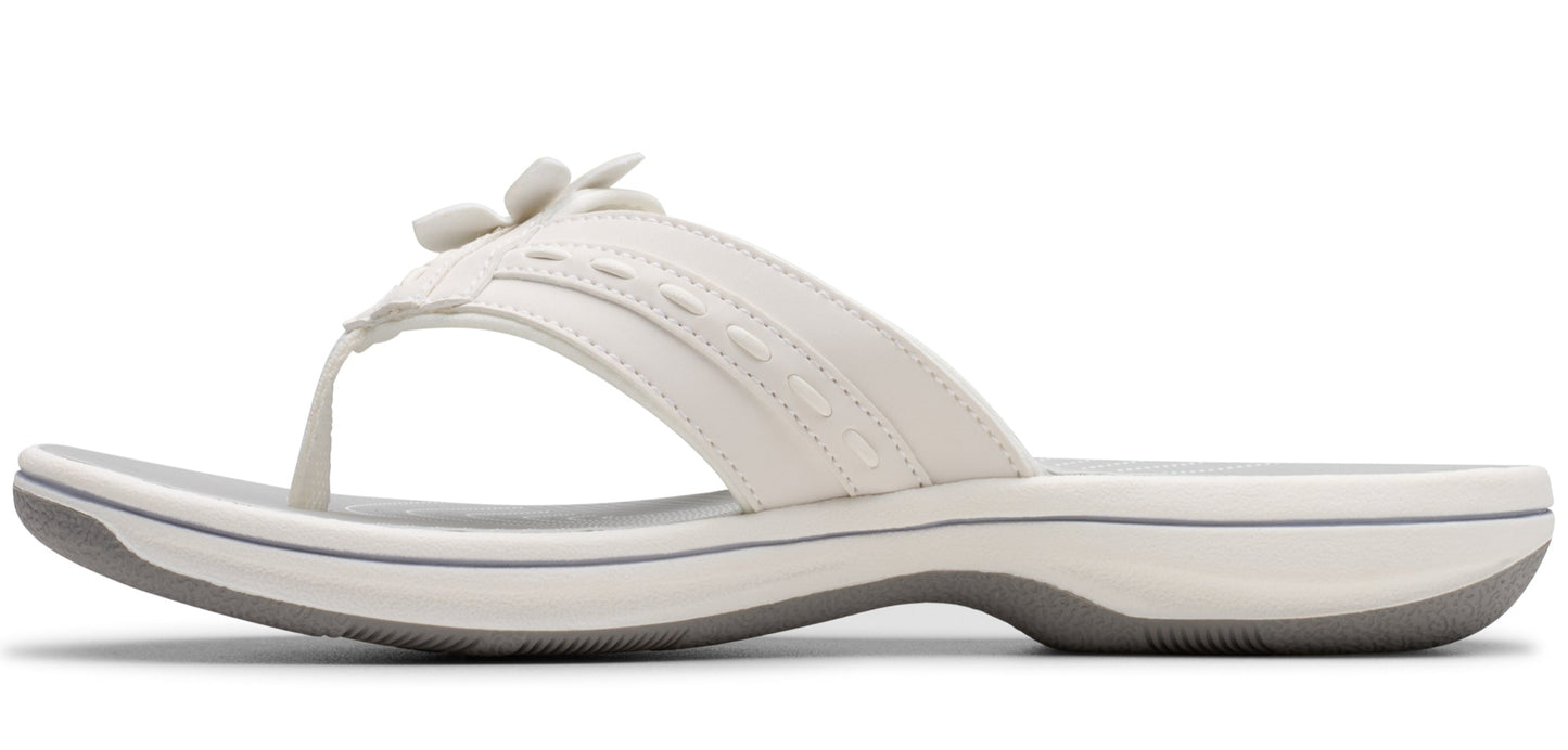 White sandal with a flower design.