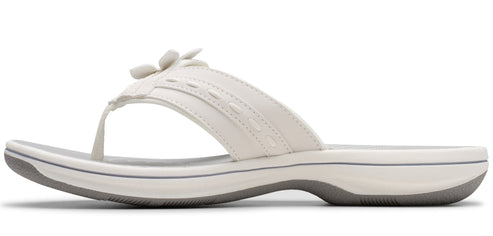 White sandal with a flower design.