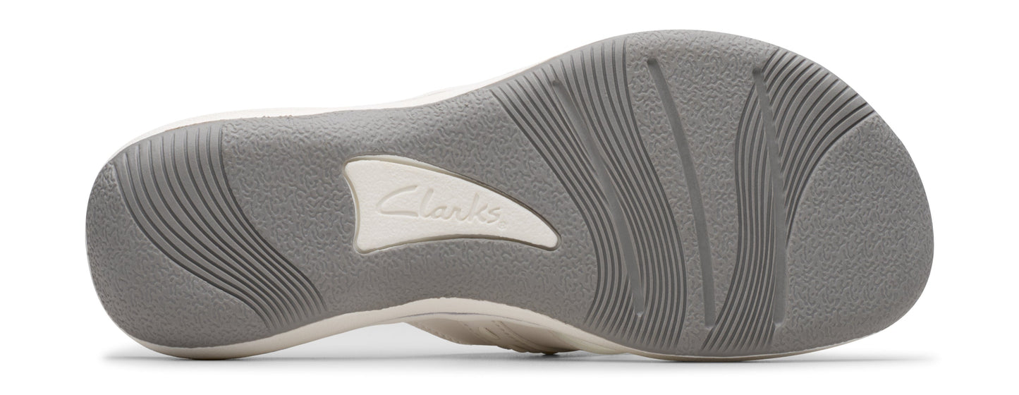 The sole of a shoe with a repeating curved line pattern and the text 'Clarks'.