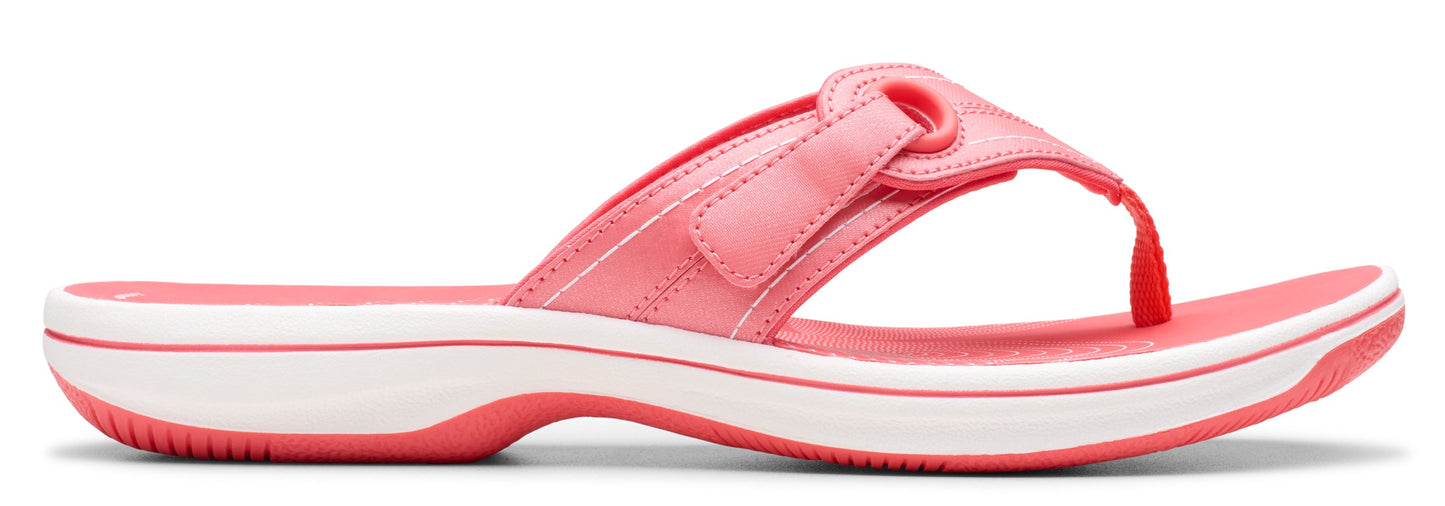 A pair of pink flip-flops with white soles.