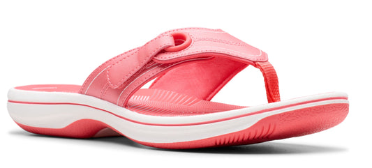 A pink flip-flop with a white sole.