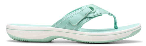 A mint-green flip-flop with a white sole.