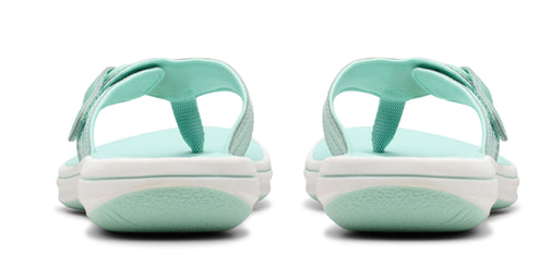 A pair of sandals with a white sole and blue upper.