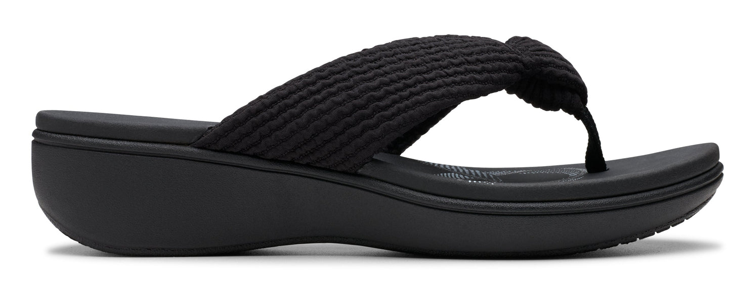 A black flip-flop sandal with a platform sole and a knotted strap.