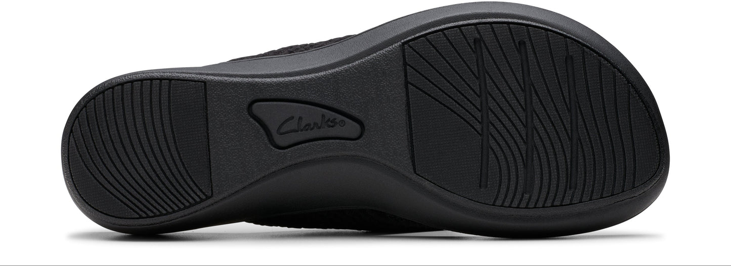 The sole of a shoe with grooves and the name "Clarks" embossed.