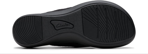 The sole of a shoe with grooves and the name "Clarks" embossed.