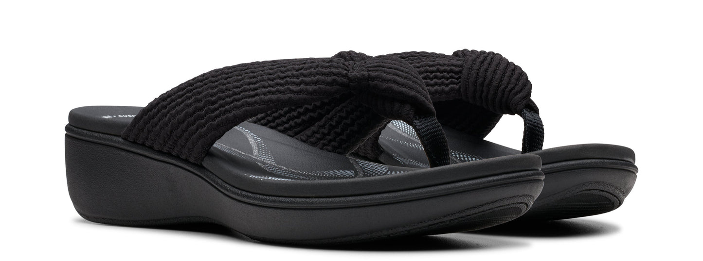 A pair of black wedge-heeled flip-flops with knotted straps.
