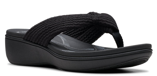 A black sandal with a wedge heel and a knitted upper.