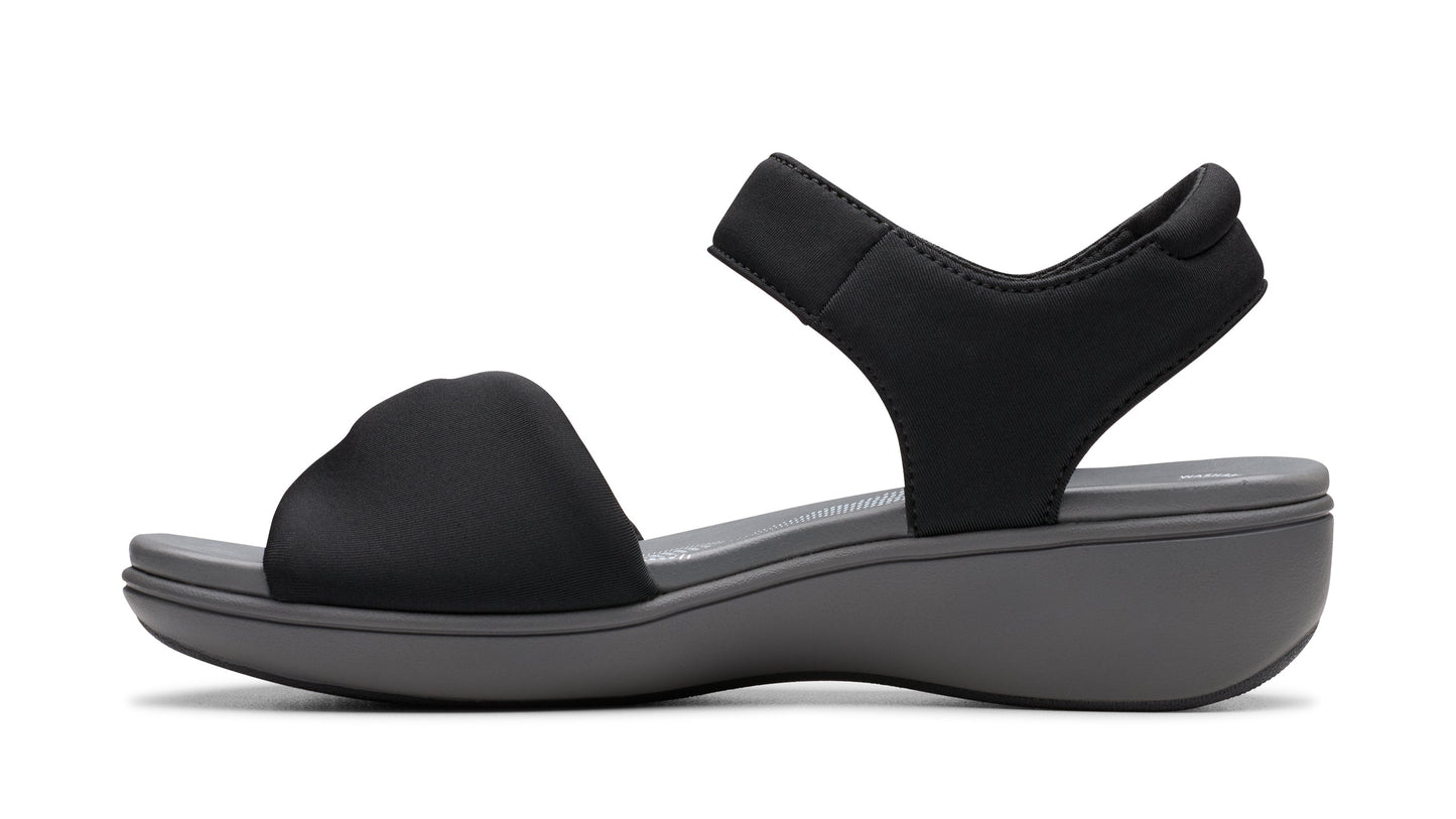 Black sandal with thick strap over toes and ankle strap.
