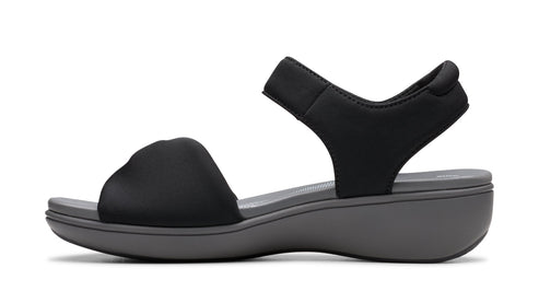 Black sandal with thick strap over toes and ankle strap.