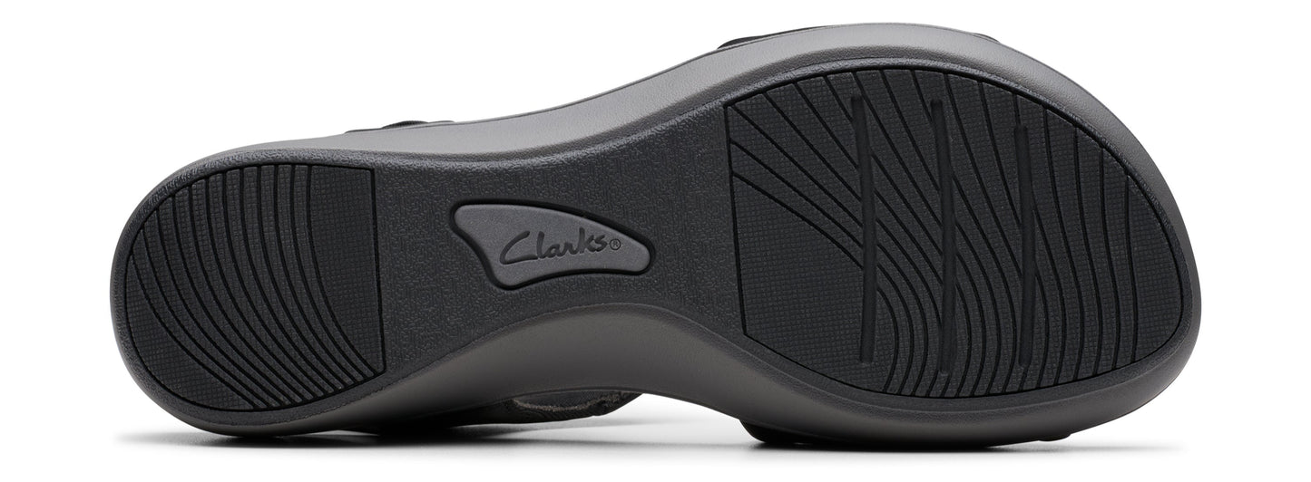 A shoe sole with a wave-like pattern and the name 'Clarks' visible.