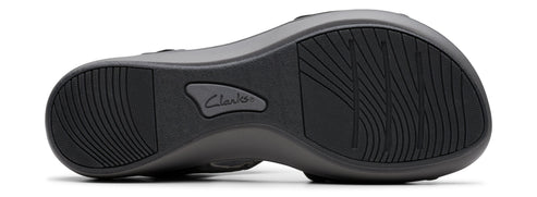 A shoe sole with a wave-like pattern and the name 'Clarks' visible.