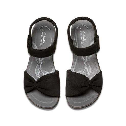 Two black Cloudsteppers sandals with bow detail and velcro straps, top view.