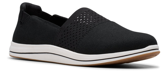 A black slip-on shoe with a white sole.