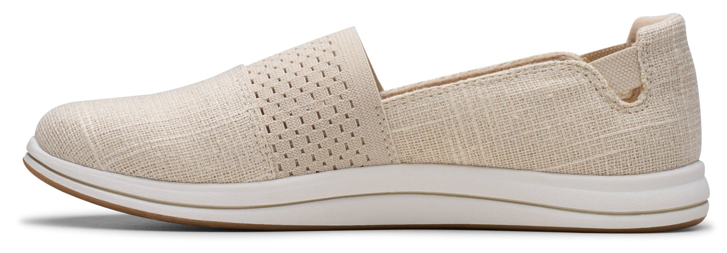 Beige slip-on shoe with perforated upper.