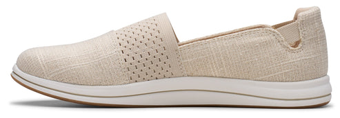 Beige slip-on shoe with perforated upper.