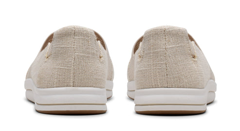 Back view of two slip-on shoes in a light, textured fabric with white midsoles and brown outsoles.
