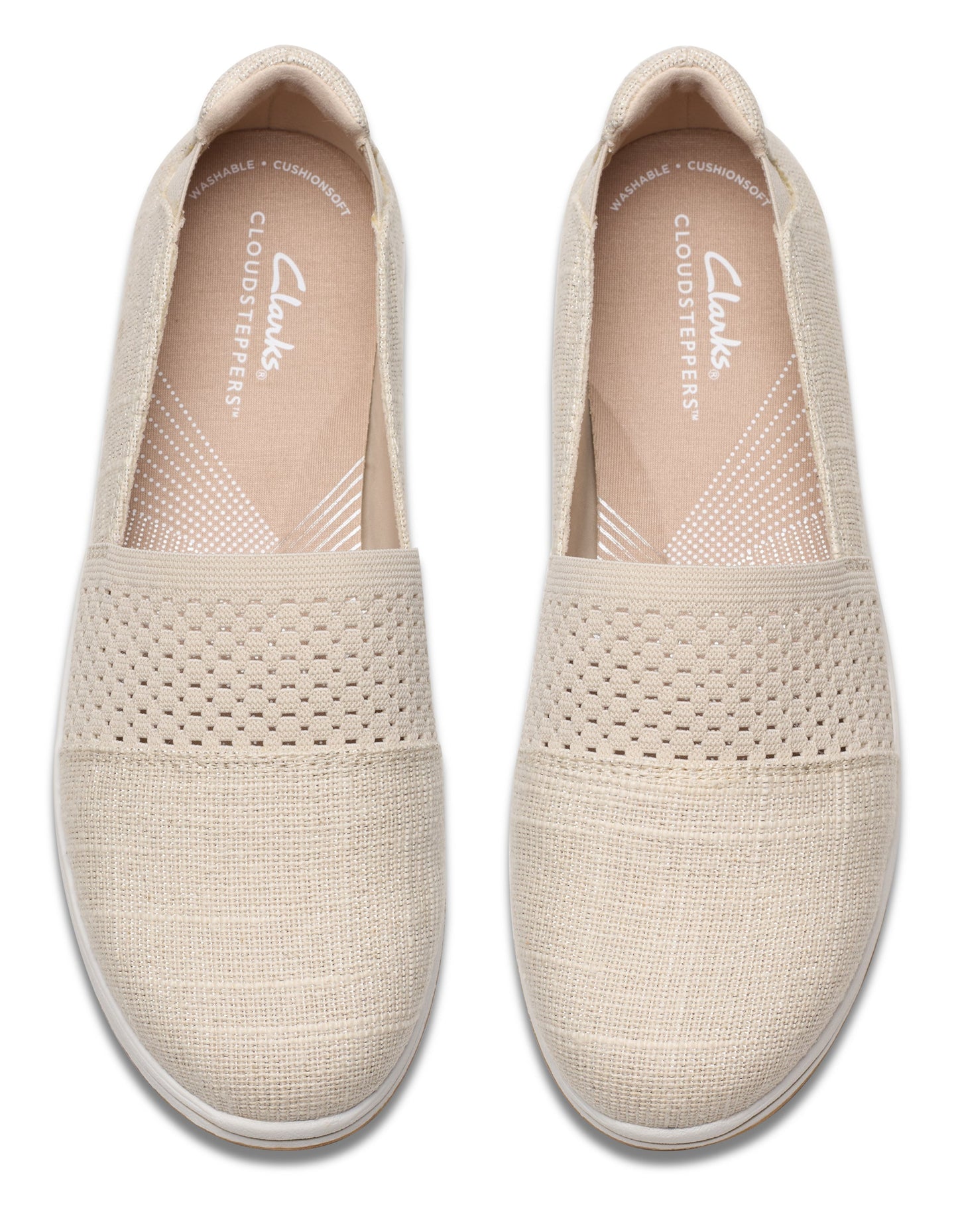 Pair of neutral slip-on casual shoes with a knit upper.