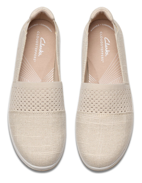 Pair of neutral slip-on casual shoes with a knit upper.