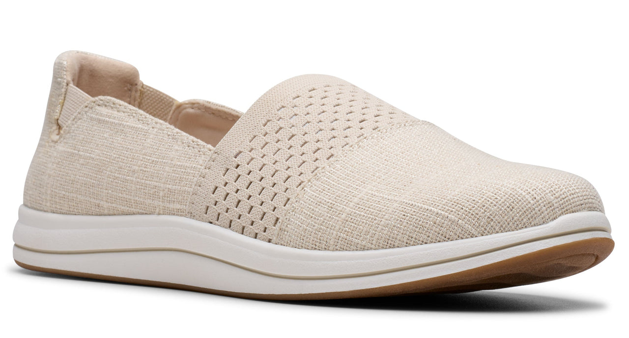 Beige slip-on shoe with ventilated top and white sole.