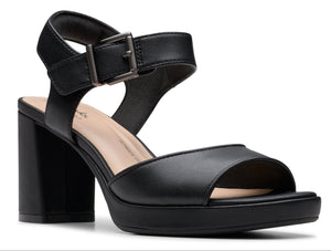 Black platform block heel sandal with toe strap and adjustable ankle strap.