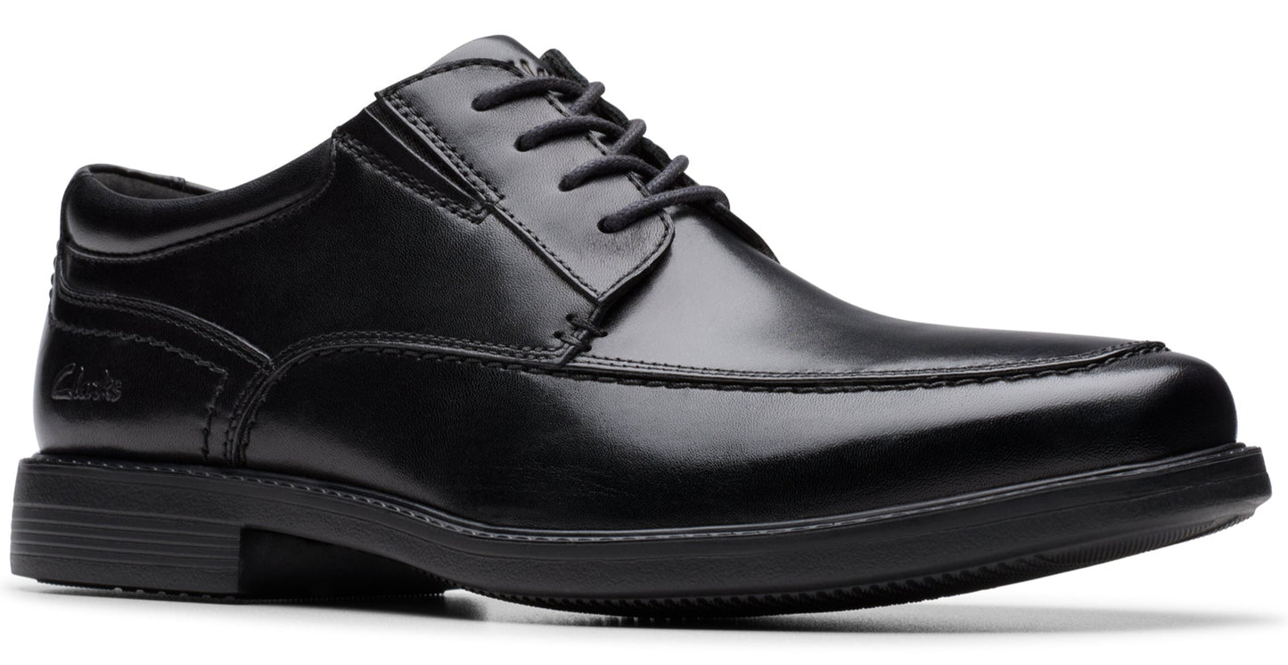 Black leather dress shoe with lace-up closure and synthetic sole.