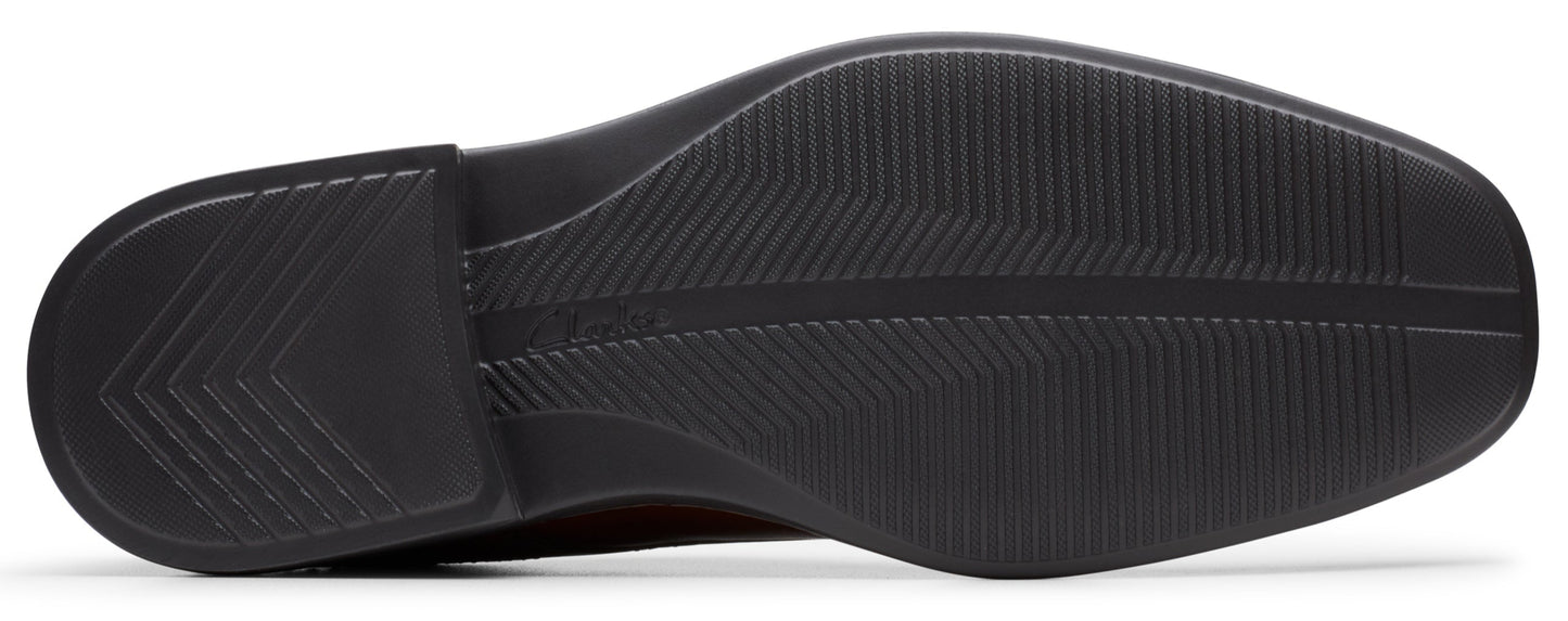 Shoe sole with tread pattern.