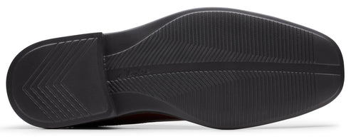 Shoe sole with tread pattern.