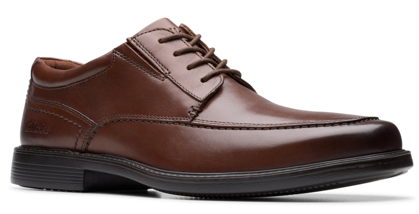 Brown leather dress shoe with lace-up closure and a black sole.