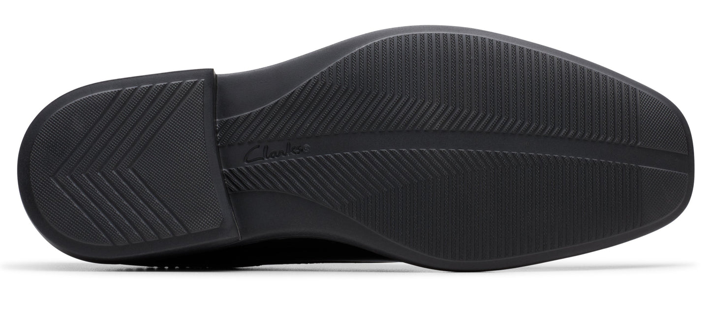 A shoe sole featuring an intricate pattern of grooves and ridges for enhanced traction.