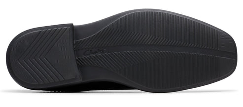 A shoe sole featuring an intricate pattern of grooves and ridges for enhanced traction.