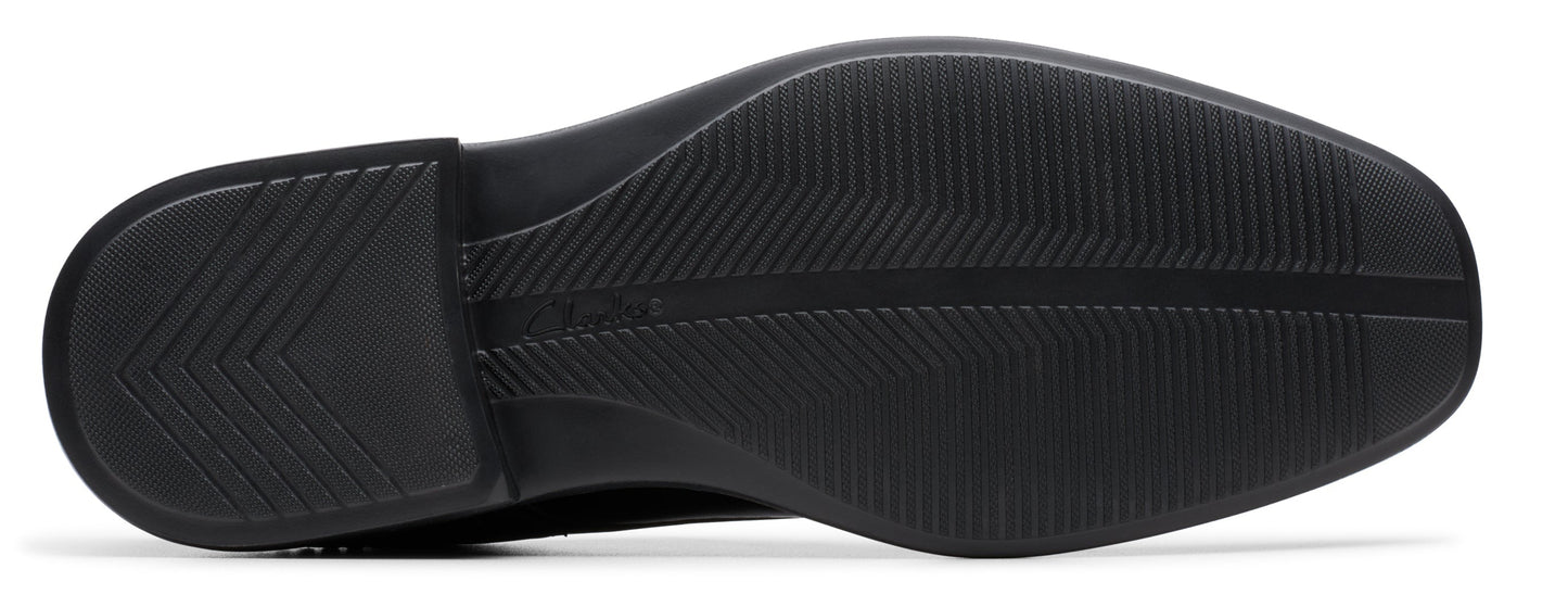 Black shoe sole with patterned texture.