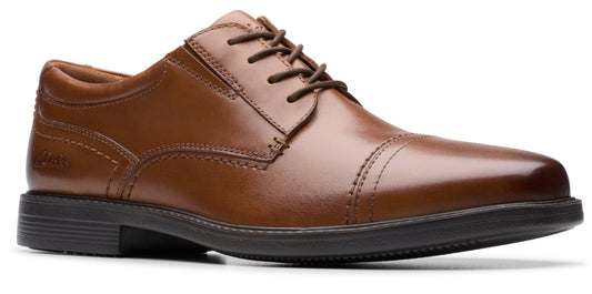 A brown leather dress shoe with laces.