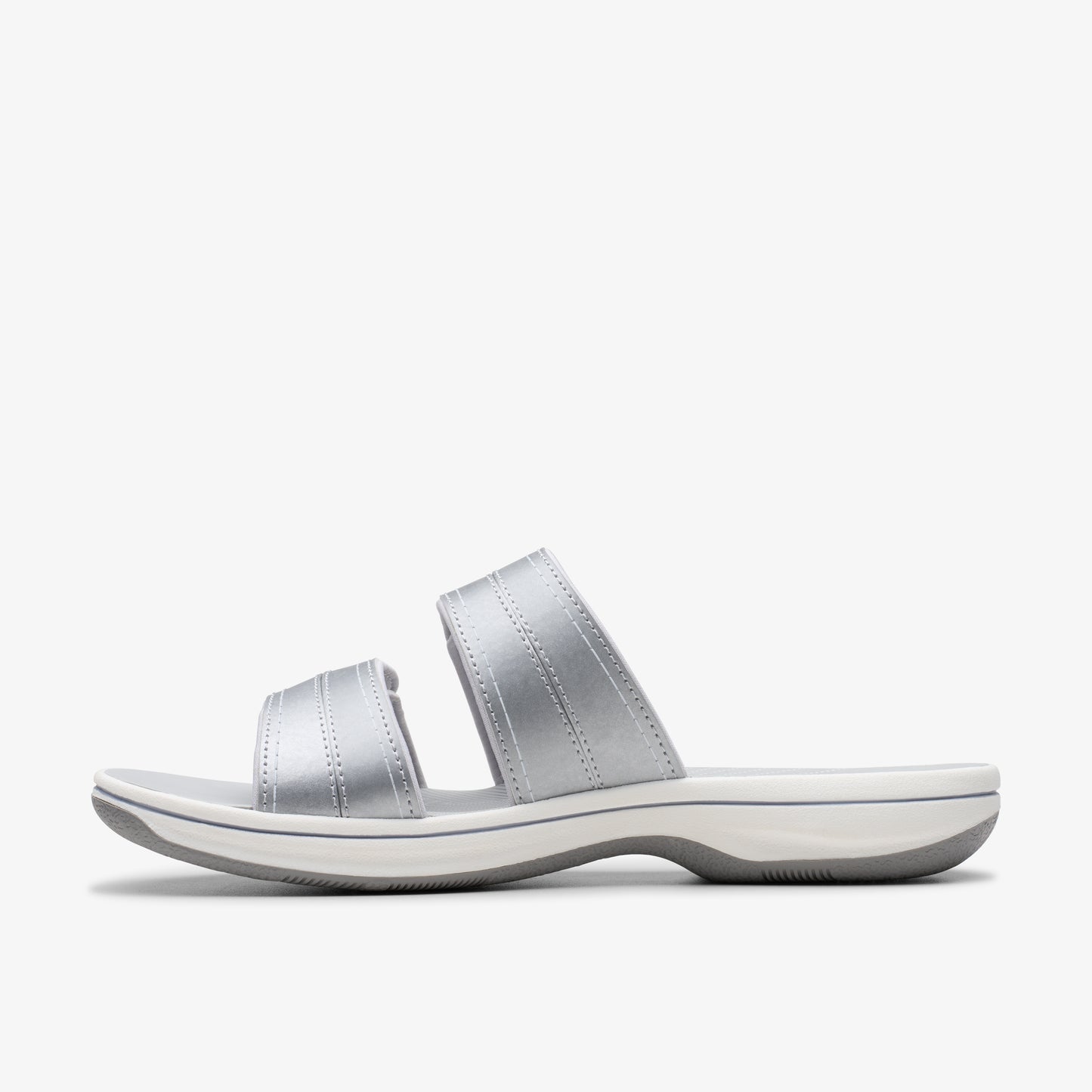 Silver slide sandals with two straps and white sole.