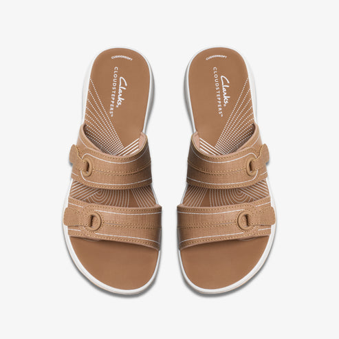 Tan-colored sandals with two adjustable straps and white soles, top view. Visible text: CLOUDSTEPPERS.