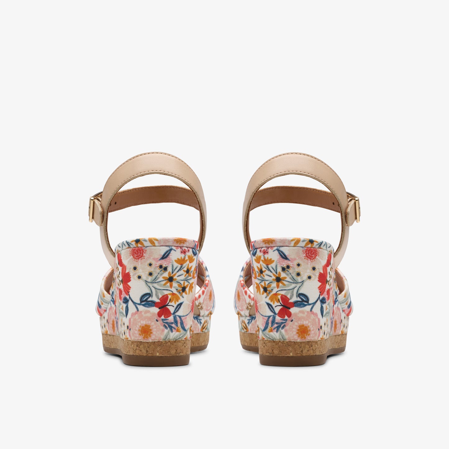 Floral pattern platform sandals with beige ankle straps, rear view.
