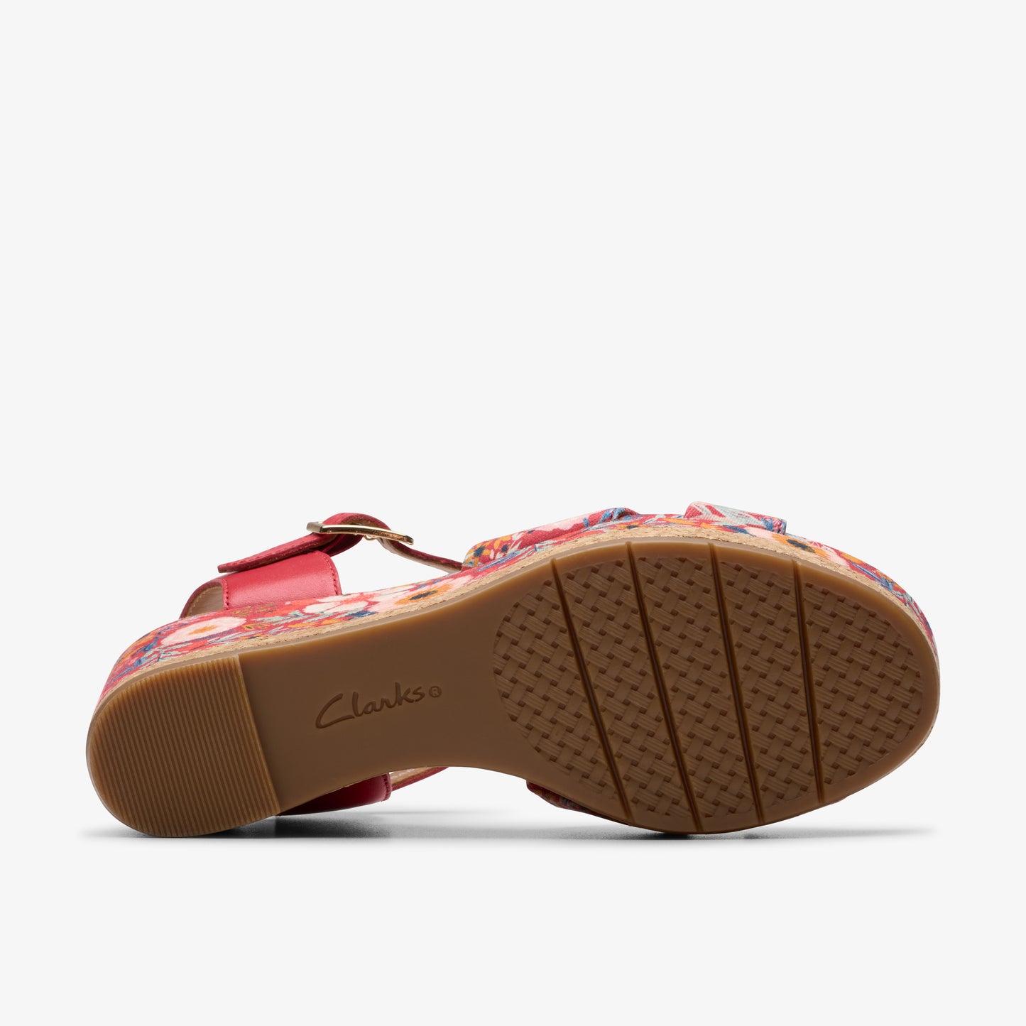 Bottom view of a floral wedge-heeled sandal.