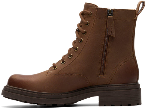 Brown leather lace-up boot with side zipper and lug sole.