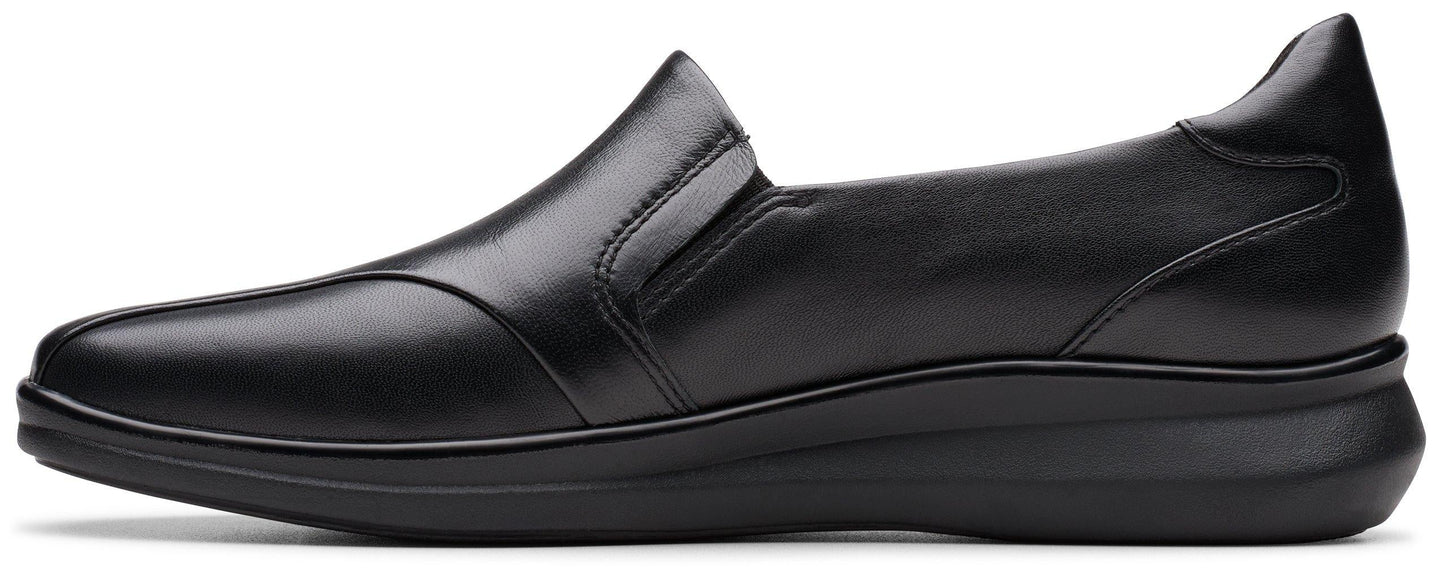 Black leather slip-on shoe with a rounded toe and a low heel.