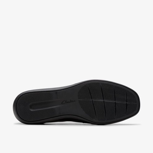 Black shoe sole with textured grid and 'Clarks' lettering.