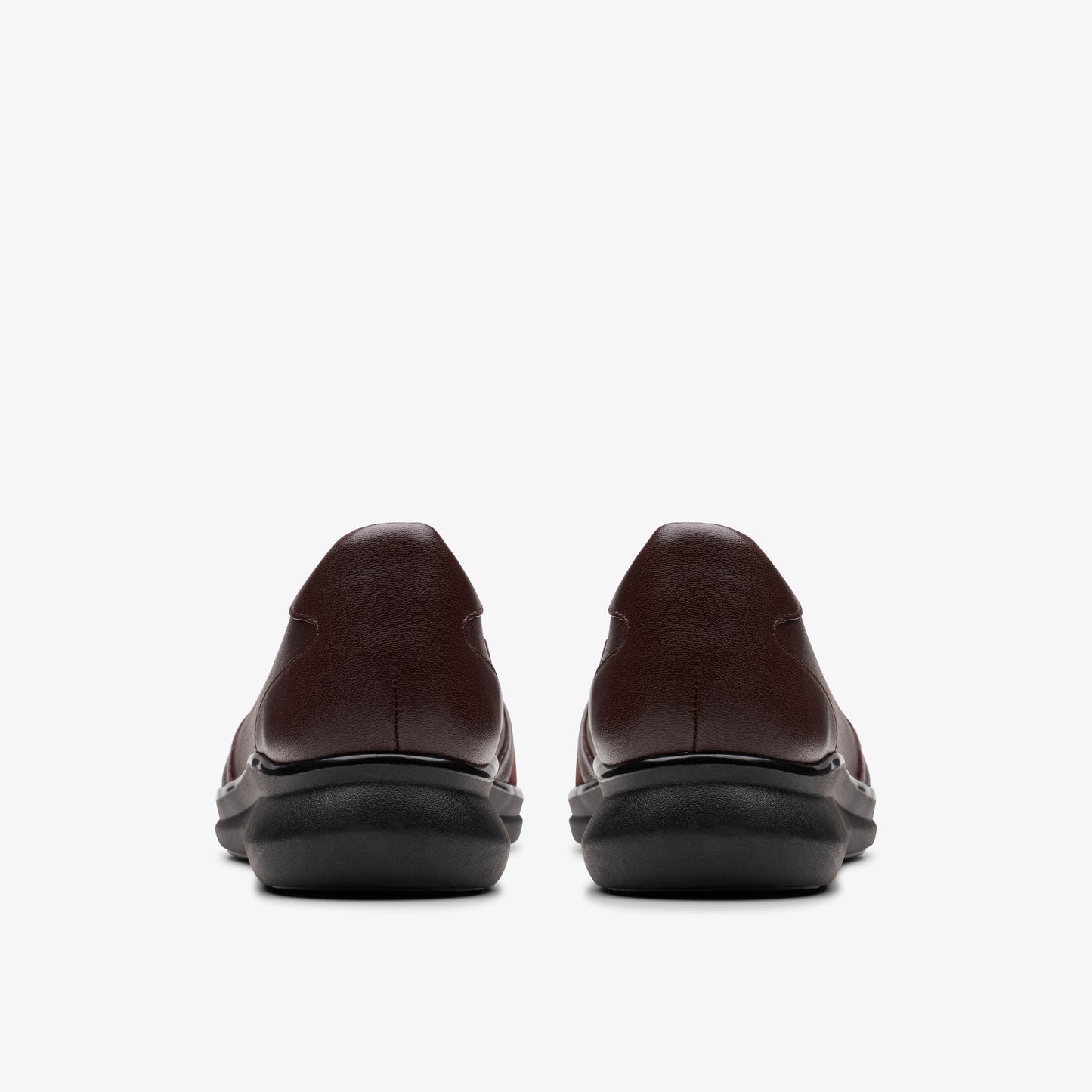 Pair of dark brown women's dress shoes, rear view.