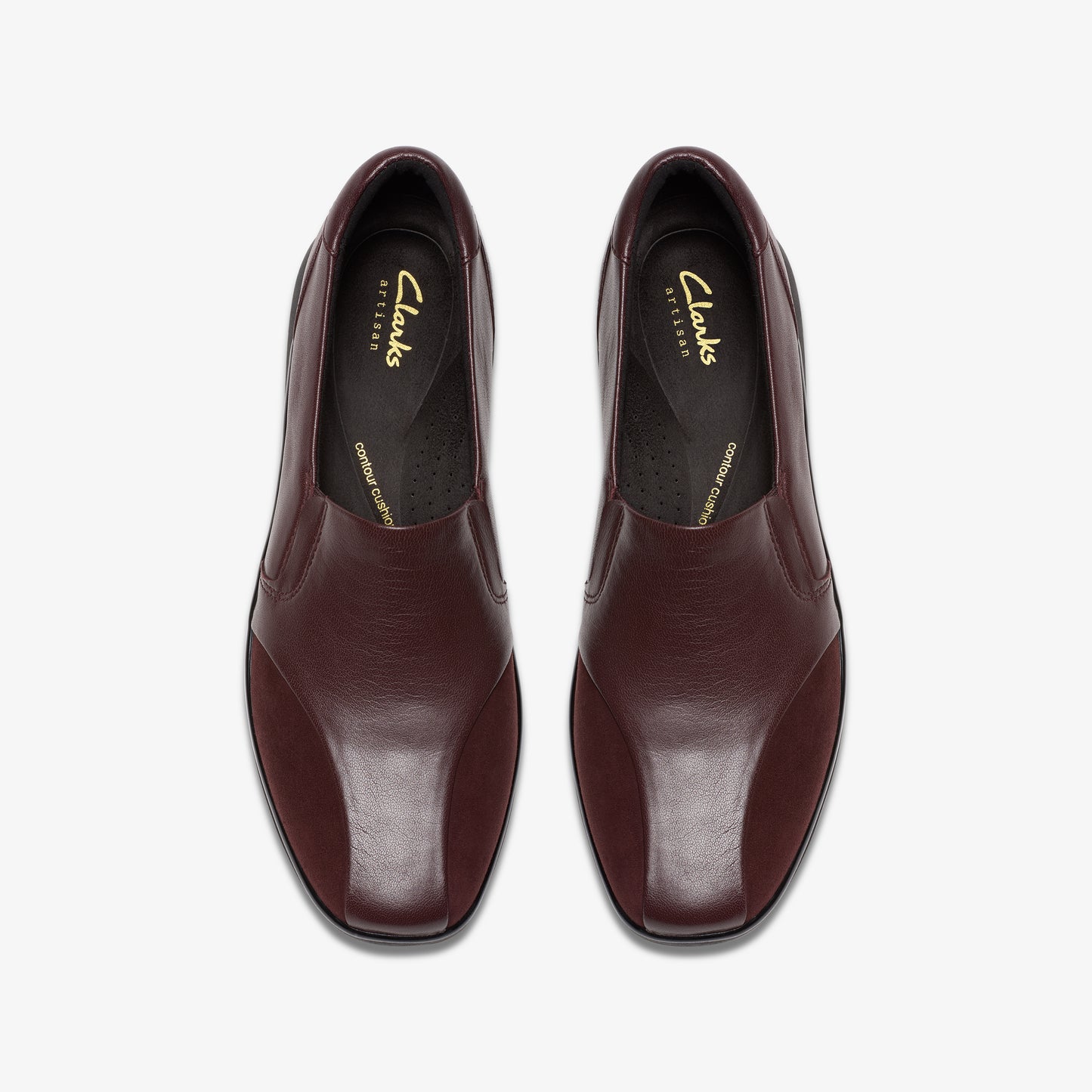 Top-down view of two reddish-brown leather shoes with elastic openings and rounded square toes.